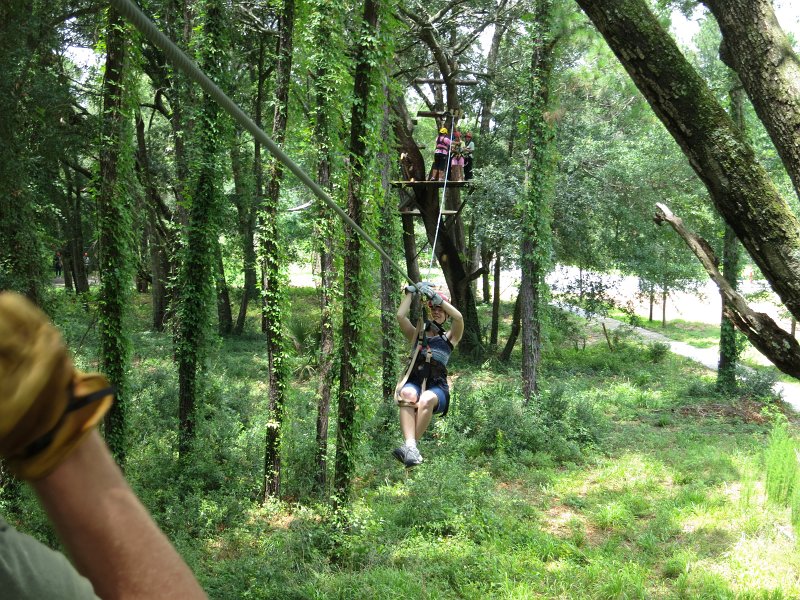 IMG_0032.jpg - Teagan enjoying herself on a zipline.